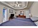 Large main bedroom with trey ceiling, ensuite, neutral walls, fan and hardwood floors at 4735 Rabbit Farm Rd, Loganville, GA 30052