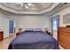 Main bedroom with trey ceilings, neutral walls, hardwood floors and an ensuite at 4735 Rabbit Farm Rd, Loganville, GA 30052