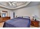 Neutral main bedroom with a trey ceiling, fan, ensuite and hardwood floors at 4735 Rabbit Farm Rd, Loganville, GA 30052
