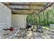 Outdoor patio area with stone flooring, pergola, grill, and seating, perfect for outdoor entertaining at 4735 Rabbit Farm Rd, Loganville, GA 30052