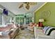 Inviting sunroom with stone floors, comfortable seating, and an abundance of natural light at 4735 Rabbit Farm Rd, Loganville, GA 30052