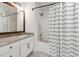 Bathroom with granite counters, new vanity, and tub shower at 215 Morris Ln, Woodstock, GA 30188