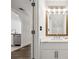 Bathroom featuring a marble countertop vanity, modern mirror, and neutral-toned walls at 215 Morris Ln, Woodstock, GA 30188