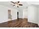 Spacious bedroom with hardwood floors and ensuite bathroom with glass shower at 215 Morris Ln, Woodstock, GA 30188