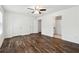 Large bedroom with hardwood floors, ceiling fan, and ensuite bathroom at 215 Morris Ln, Woodstock, GA 30188
