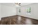 Large bedroom with hardwood floors and two large windows at 215 Morris Ln, Woodstock, GA 30188