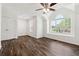 Large bedroom with vaulted ceiling, hardwood floors, and large windows at 215 Morris Ln, Woodstock, GA 30188