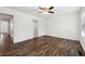 Spacious bedroom featuring hardwood floors, white walls, and a ceiling fan at 215 Morris Ln, Woodstock, GA 30188