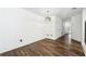 Bright living room with hardwood floors and modern lighting fixture at 215 Morris Ln, Woodstock, GA 30188