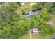Scenic aerial view of the property and pond with a fountain amidst a lush green landscape at 4618 Barkley Nw Dr, Acworth, GA 30101