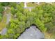 Lush trees and landscaping surround property near a pond with a fountain in a quiet community at 4618 Barkley Nw Dr, Acworth, GA 30101