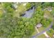 Aerial view of the property near a scenic pond with fountain and surrounded by lush greenery at 4618 Barkley Nw Dr, Acworth, GA 30101