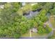 Overhead shot of pond and tree-surrounded property with mature landscaping and a fountain at 4618 Barkley Nw Dr, Acworth, GA 30101