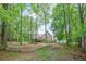 A large backyard with mature trees surrounds the home, offering a private and peaceful setting at 4618 Barkley Nw Dr, Acworth, GA 30101