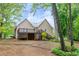 Enjoy a sprawling backyard with a deck, mature trees, and ample space for outdoor activities and relaxation at 4618 Barkley Nw Dr, Acworth, GA 30101