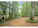 The spacious backyard includes a storage shed, lush landscaping, and mature trees, offering a peaceful retreat at 4618 Barkley Nw Dr, Acworth, GA 30101