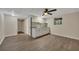 Spacious basement featuring wood-look floors, a ceiling fan, and a granite counter and sink at 4618 Barkley Nw Dr, Acworth, GA 30101