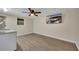 Open basement space features wood-look floors, modern lighting, and a mounted television at 4618 Barkley Nw Dr, Acworth, GA 30101