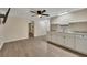 Well-lit basement with wood-look floors, sink, and open layout is perfect for entertaining at 4618 Barkley Nw Dr, Acworth, GA 30101