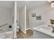 Bright bathroom featuring tub, separate shower, double sinks, and modern fixtures at 4618 Barkley Nw Dr, Acworth, GA 30101