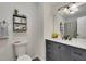 Cozy bathroom with decorative shelf, modern vanity, and stylish decor at 4618 Barkley Nw Dr, Acworth, GA 30101