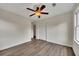 Bedroom with laminate floors, ceiling fan and neutral walls at 4618 Barkley Nw Dr, Acworth, GA 30101