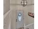 Bright foyer with a decorative front door, a stylish light fixture, and white banisters at 4618 Barkley Nw Dr, Acworth, GA 30101