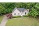 Aerial view of a well-maintained home with a lush lawn and manicured landscaping, showcasing its curb appeal at 4618 Barkley Nw Dr, Acworth, GA 30101