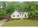 Charming single-Gathering home with a well-manicured lawn and lush trees surrounding the property at 4618 Barkley Nw Dr, Acworth, GA 30101