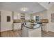 Well-lit kitchen featuring an island, modern appliances, tiled backsplash, and ample counter space at 4618 Barkley Nw Dr, Acworth, GA 30101