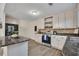 Well-designed kitchen with stainless steel appliances, island, and ample counter space for cooking at 4618 Barkley Nw Dr, Acworth, GA 30101
