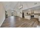 Spacious living area with wood floors, fireplace, and easy access to the kitchen and upstairs at 4618 Barkley Nw Dr, Acworth, GA 30101
