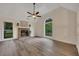 Spacious living room with a fireplace, vaulted ceilings, and large windows at 4618 Barkley Nw Dr, Acworth, GA 30101
