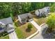 Aerial view showcases the property's placement among other houses and lush green surroundings at 1450 Steam Engine Way, Conyers, GA 30013