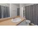 Bathroom featuring a sink, mirror, toilet, shower and neutral finishes at 1450 Steam Engine Way, Conyers, GA 30013