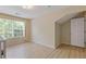 Bedroom with light wood floors, neutral walls, natural light, and doorway at 1450 Steam Engine Way, Conyers, GA 30013
