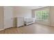 Neutral-toned Bedroom featuring wood floors, natural light, with white baby furniture at 1450 Steam Engine Way, Conyers, GA 30013
