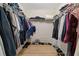 Spacious walk-in closet features custom shelving for ample storage and organization of clothing and shoes at 1450 Steam Engine Way, Conyers, GA 30013