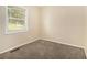 Cozy bedroom offers plush carpeting, neutral walls, and bright natural light at 3693 Larkspur Ter, Decatur, GA 30032