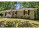 Charming brick home with mature trees and lovely landscaping offers great curb appeal at 3693 Larkspur Ter, Decatur, GA 30032