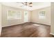 Bright living room featuring gleaming hardwood floors, neutral paint, and natural light at 3693 Larkspur Ter, Decatur, GA 30032