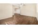 Open-concept living room with hardwood floors, neutral colors, and modern lighting at 3693 Larkspur Ter, Decatur, GA 30032