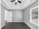 A bright bedroom with a ceiling fan and a window, perfect for relaxation at 5854 Cobalt Dr, Powder Springs, GA 30127