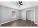 Bedroom with dark flooring, fan and gray walls at 5854 Cobalt Dr, Powder Springs, GA 30127