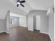 Bedroom with dark flooring, light-gray walls and a ceiling fan with views of the exterior at 5854 Cobalt Dr, Powder Springs, GA 30127