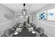 Open-concept dining room showcasing elegant table setting and stylish decor that flows to a kitchen at 5854 Cobalt Dr, Powder Springs, GA 30127