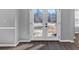 Front entryway with stylish wood flooring, transom windows, and a glass door at 5854 Cobalt Dr, Powder Springs, GA 30127