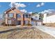 Beautiful two-story brick home with a two-car garage, enhanced by blue skies and lush greenery at 5854 Cobalt Dr, Powder Springs, GA 30127