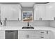 Bright kitchen featuring white cabinets, stainless steel appliances, and a window view at 5854 Cobalt Dr, Powder Springs, GA 30127