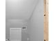Laundry room with white door and gray walls ready for washer and dryer hookups at 5854 Cobalt Dr, Powder Springs, GA 30127